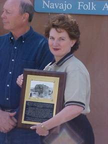 Judy Christa-Cathey Holds Plaque