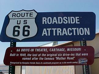66 Drive-In Attraction Sign